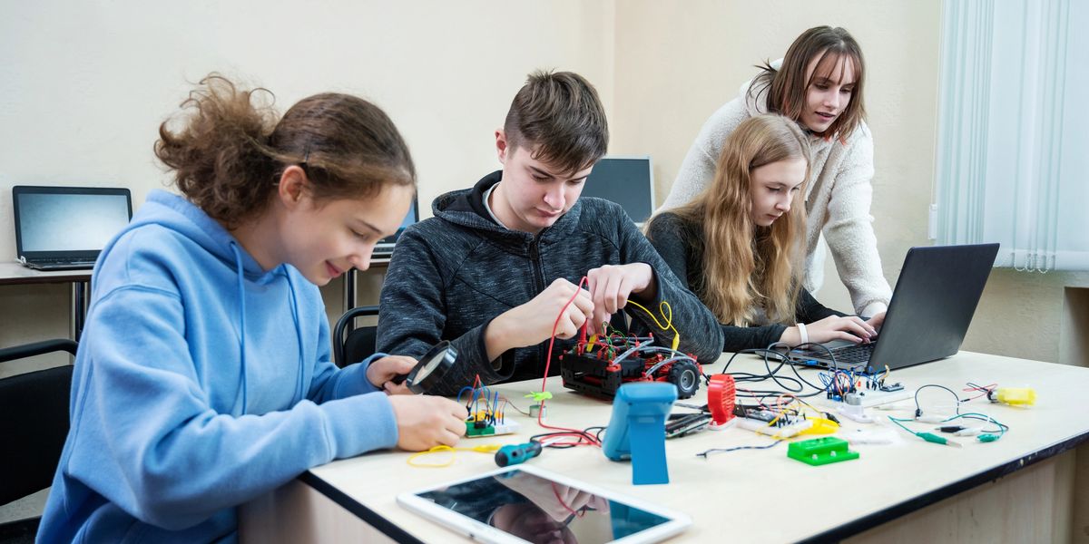 Students collaborating on a hands-on technology project